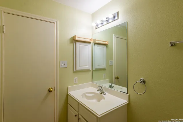 a bathroom with a toilet and shower