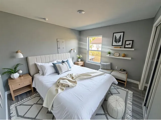 a bathroom with a double vanity sink toilet mirror and shower