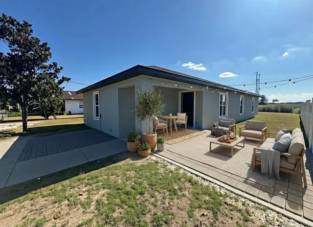 a view of a terrace with furniture and potted plants