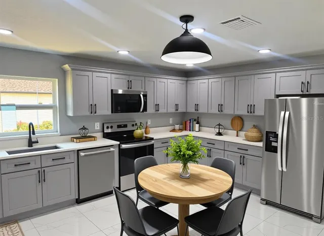 a bedroom with a bed and chandelier