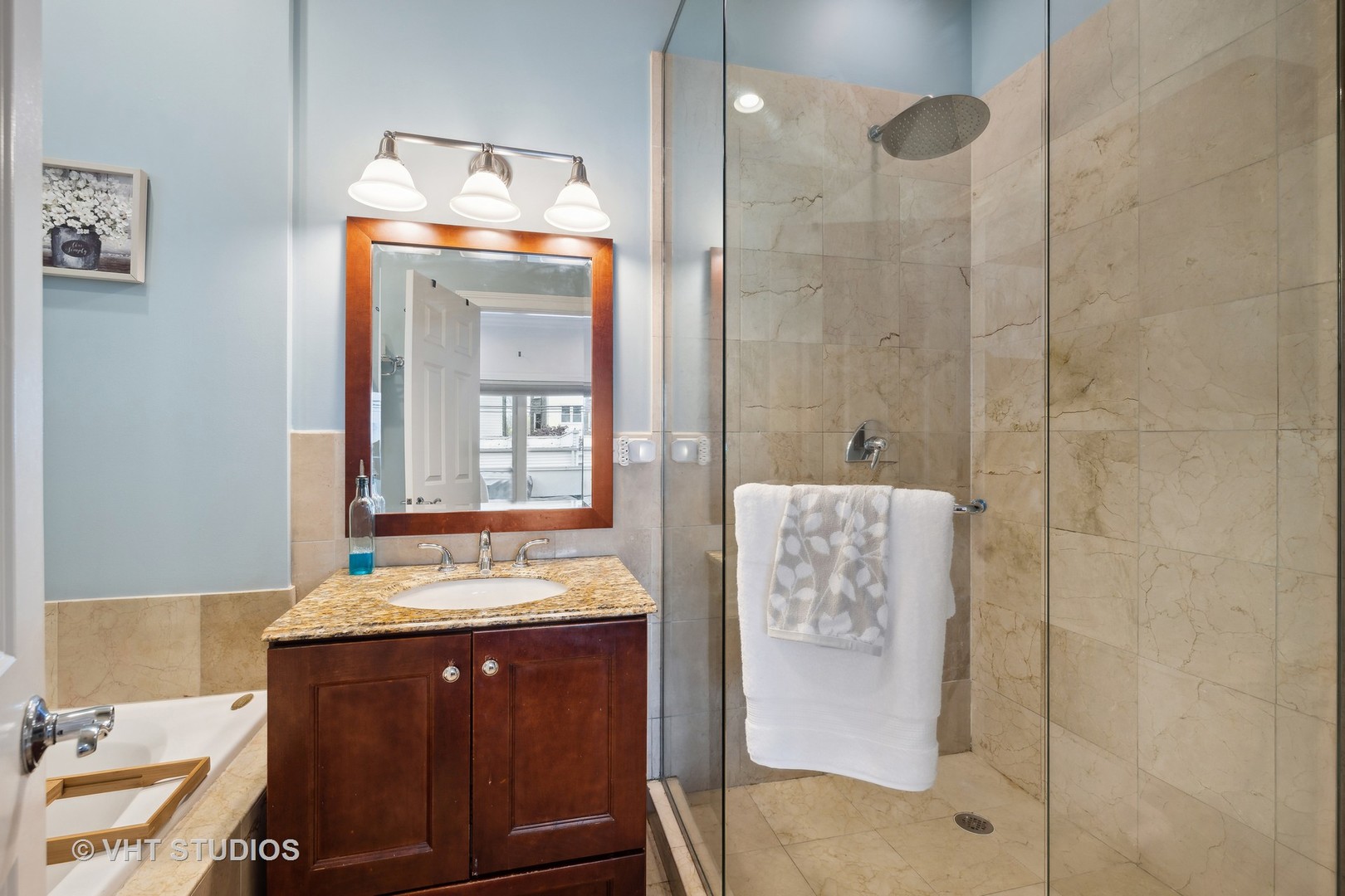 2128 West Walton Street, Unit 1E Chicago, IL 60622 - Photo 12 of 23 a bathroom with a sink and a mirror