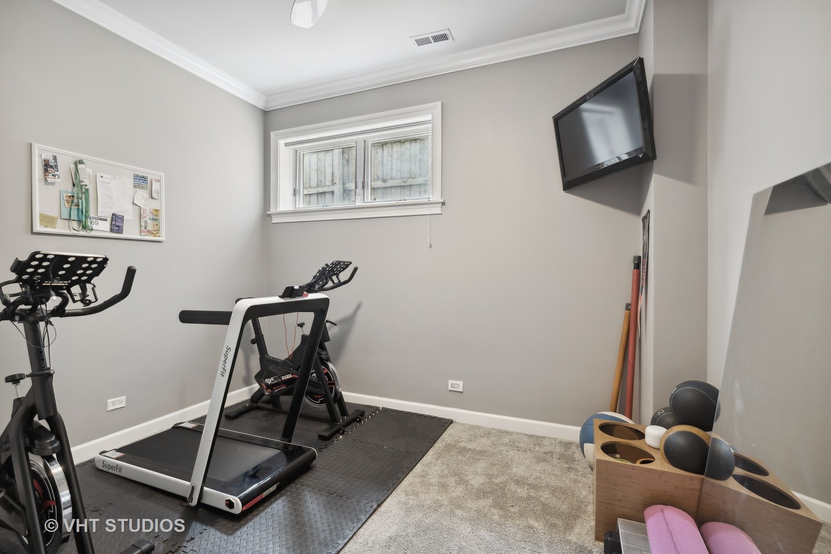 2128 West Walton Street, Unit 1E Chicago, IL 60622 - Photo 15 of 23 a work room with furniture and a flat screen tv