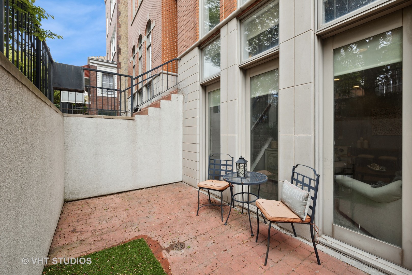 2128 West Walton Street, Unit 1E Chicago, IL 60622 - Photo 17 of 23 a view of two chairs in a patio