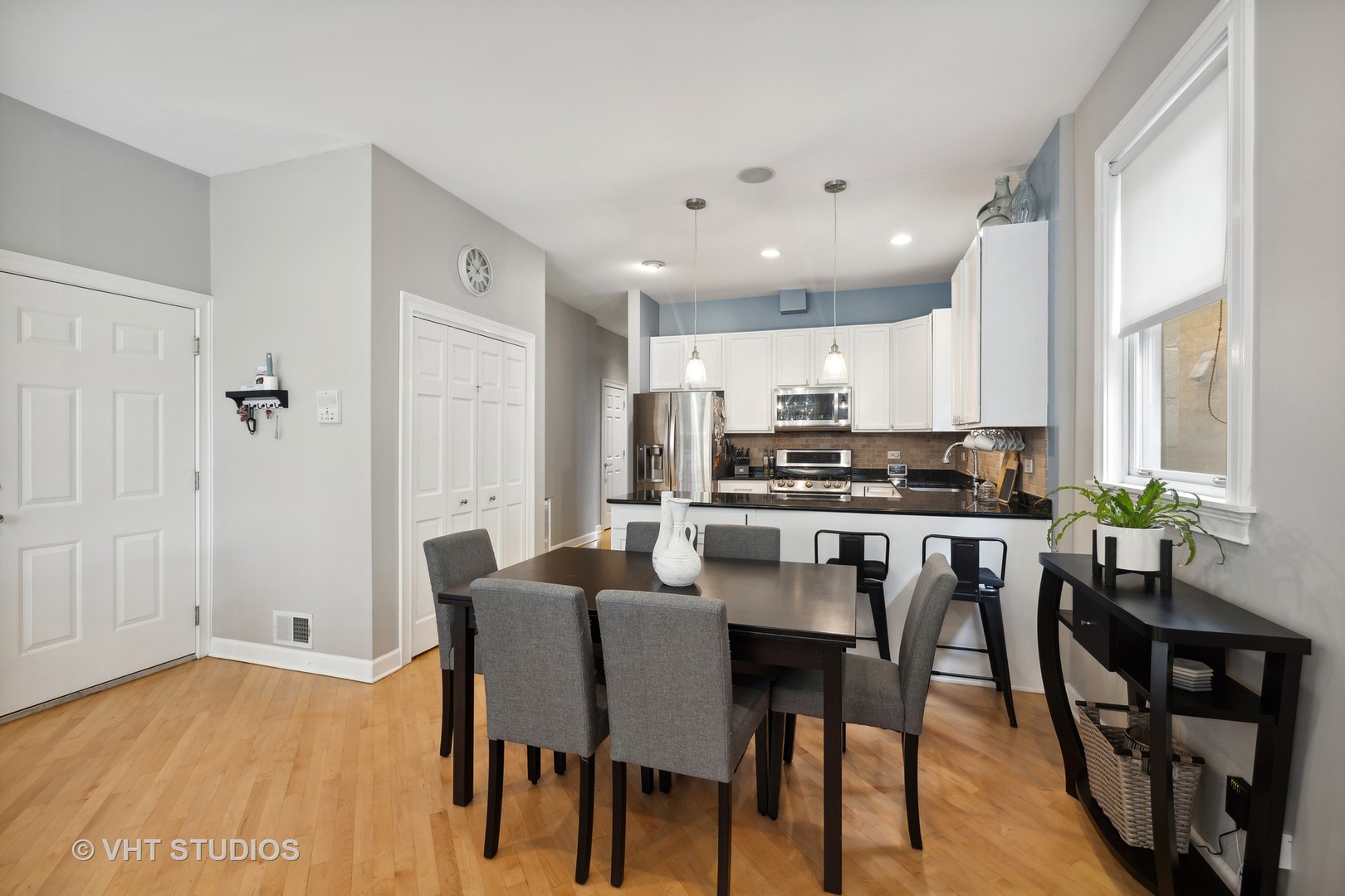 2128 West Walton Street, Unit 1E Chicago, IL 60622 - Photo 4 of 23 a view of a dining room with furniture and wooden floor