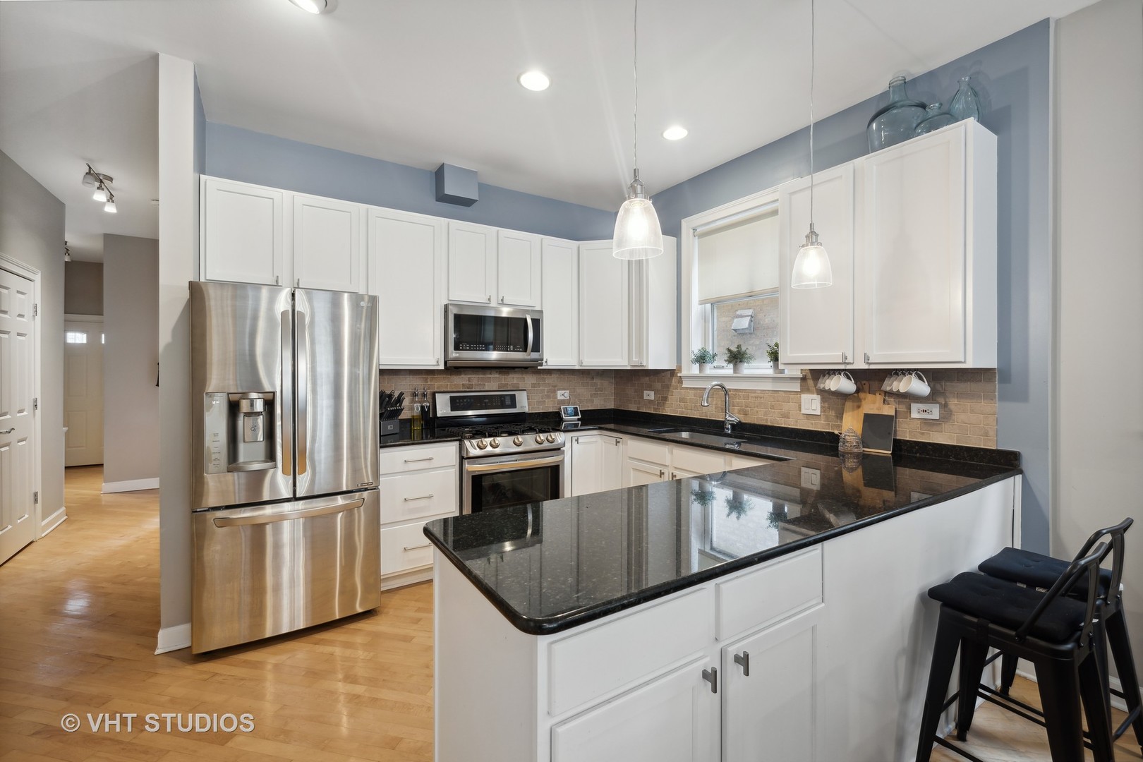 2128 West Walton Street, Unit 1E Chicago, IL 60622 - Photo 5 of 23 a kitchen with a refrigerator sink and microwave