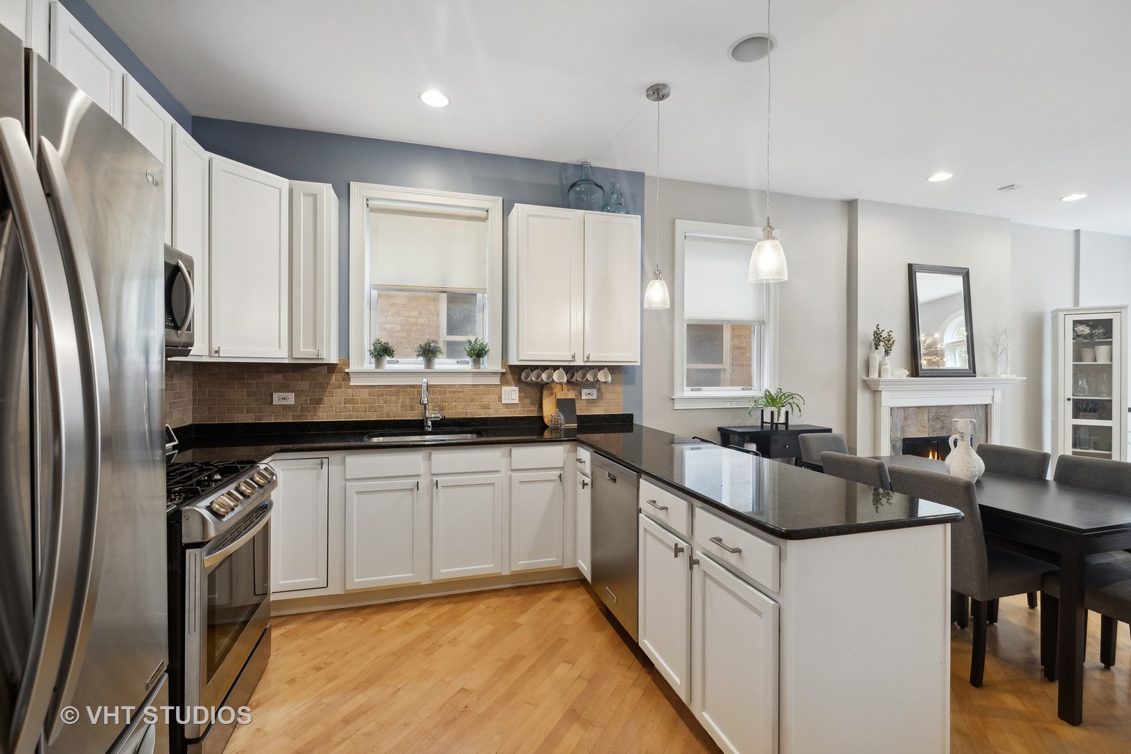 2128 West Walton Street, Unit 1E Chicago, IL 60622 - Photo 6 of 23 a kitchen with stainless steel appliances granite countertop a sink stove and refrigerator