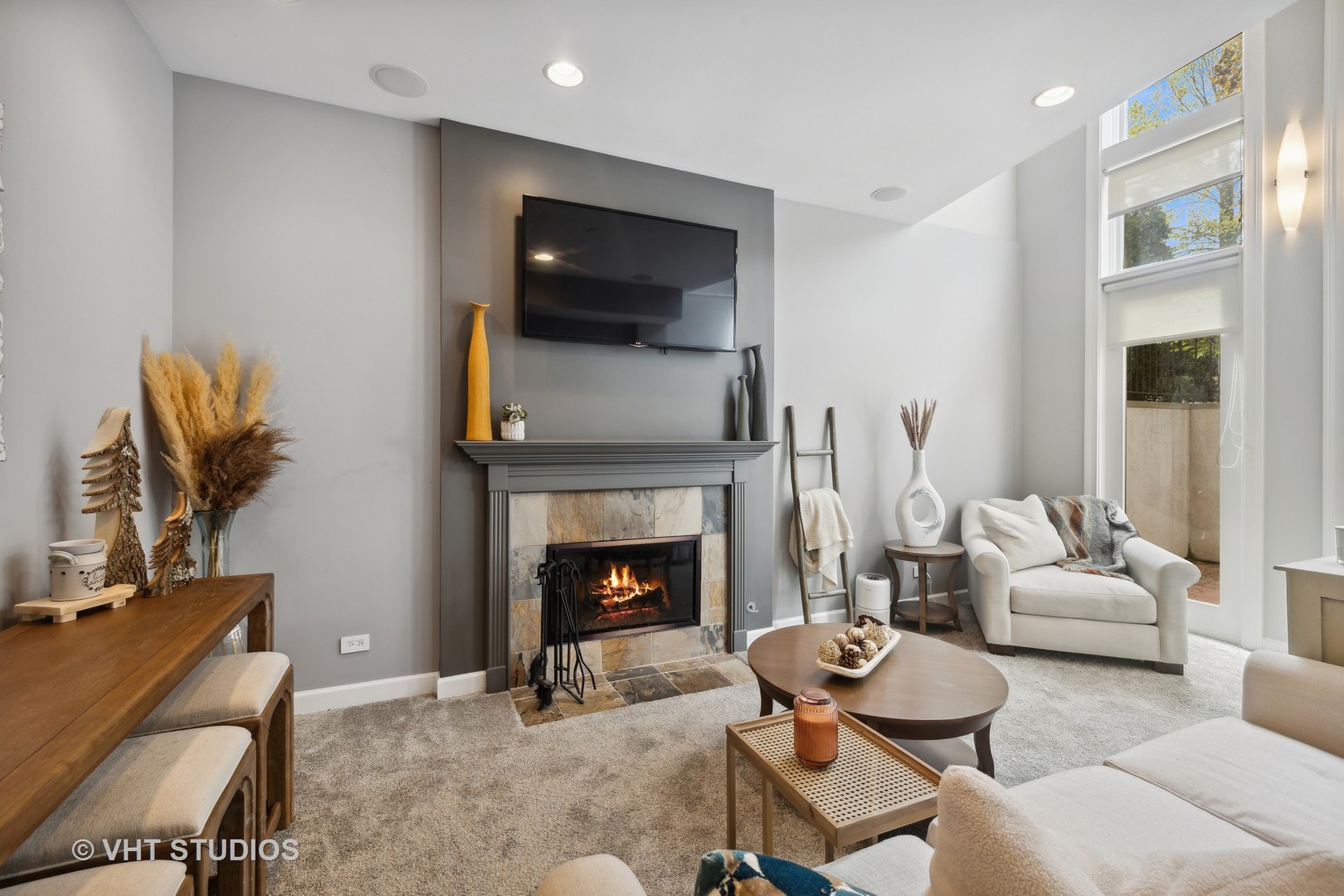 2128 West Walton Street, Unit 1E Chicago, IL 60622 - Photo 7 of 23 a living room with furniture a flat screen tv and a fireplace