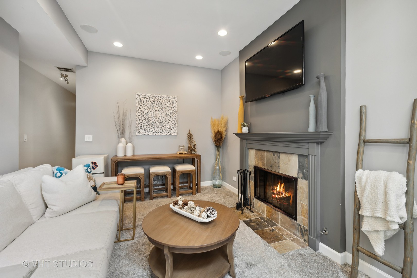 2128 West Walton Street, Unit 1E Chicago, IL 60622 - Photo 8 of 23 a living room with furniture a flat screen tv and a fireplace