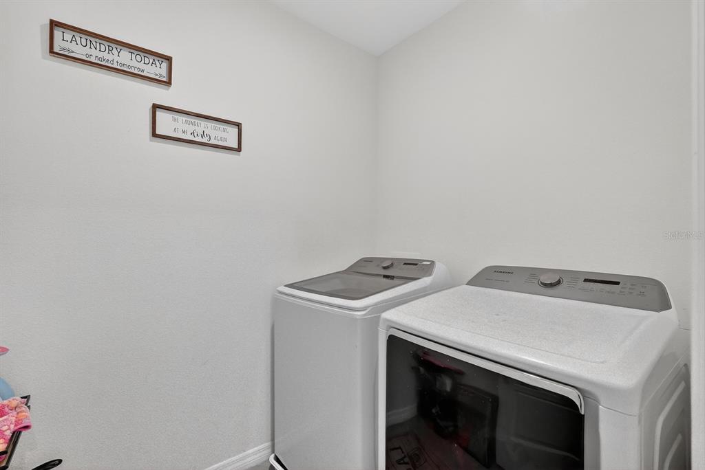 1809 Myrtlebrooke Drive Edgewater, FL 32141 - Photo 34 of 58 a utility room with dryer and washer