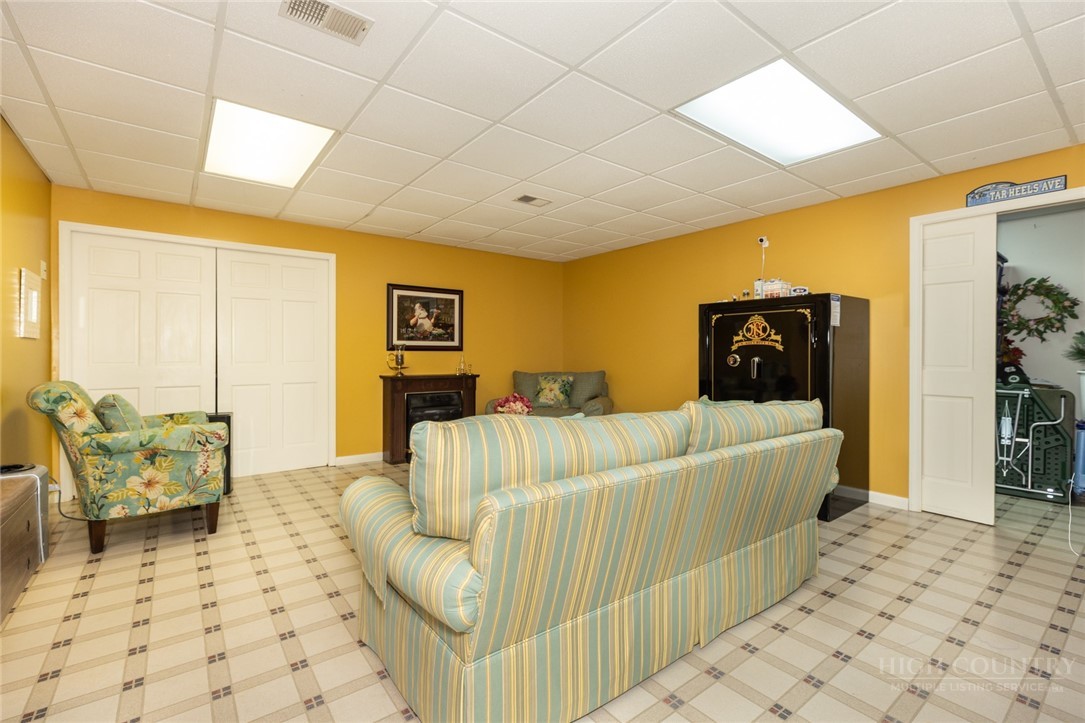 1335 Shingle Gap Road Purlear, NC 28665 - Photo 30 of 49 a living room with furniture and a rug
