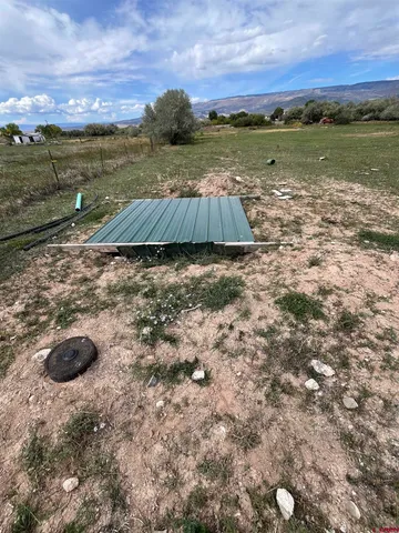 a view of a yard with an ocean