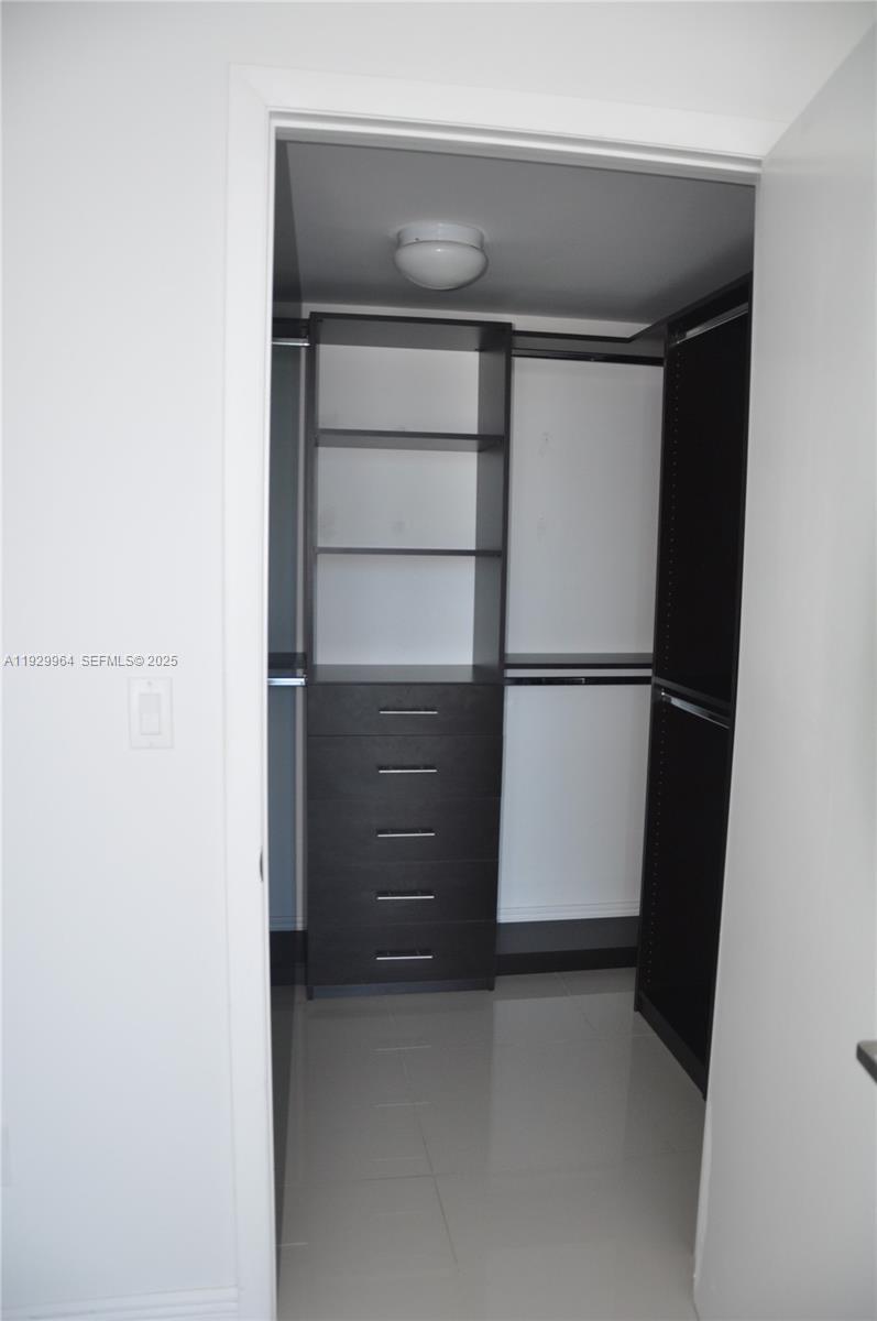 475 Brickell Avenue, Unit 4215 Miami, FL 33131 - Photo 9 of 17 a room with closet