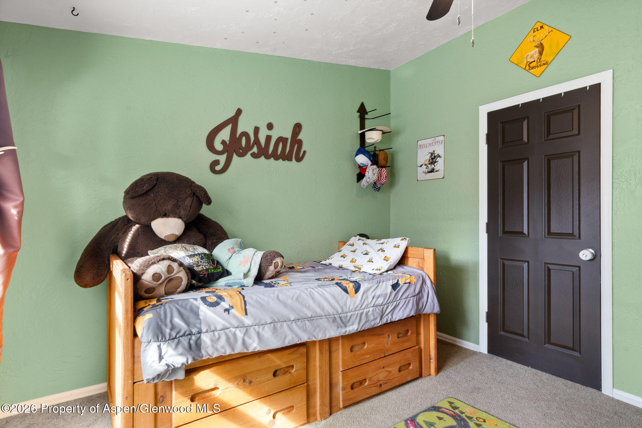 106 Cedar Circle Parachute, CO 81635 - Photo 15 of 35 a bed room with furniture and a window