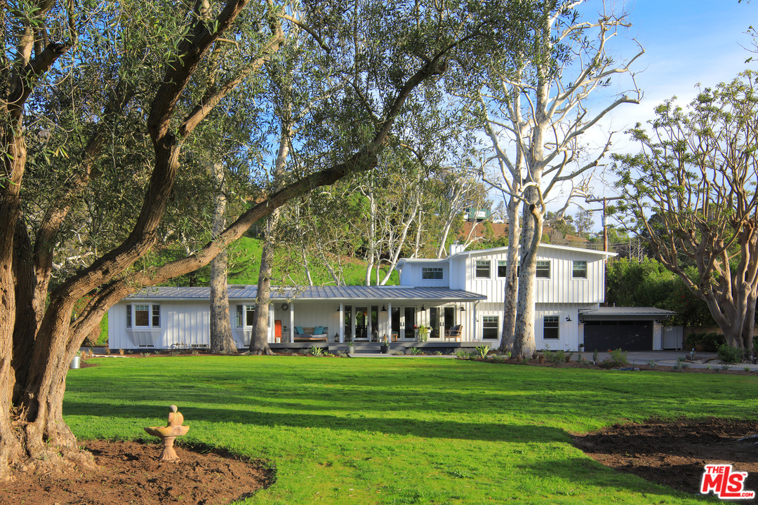 6152 Bonsall Drive Malibu, CA 90265 - Photo 2 of 26 a front view of a house with a garden