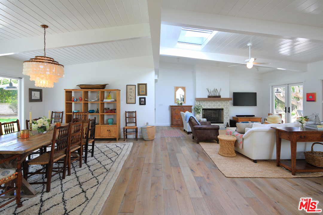 6152 Bonsall Drive Malibu, CA 90265 - Photo 11 of 26 a living room with furniture a fireplace and a flat screen tv