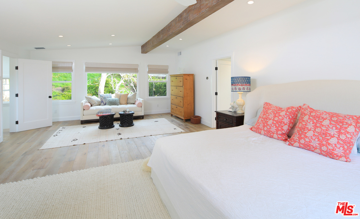 6152 Bonsall Drive Malibu, CA 90265 - Photo 15 of 26 a living room with furniture large window and a table