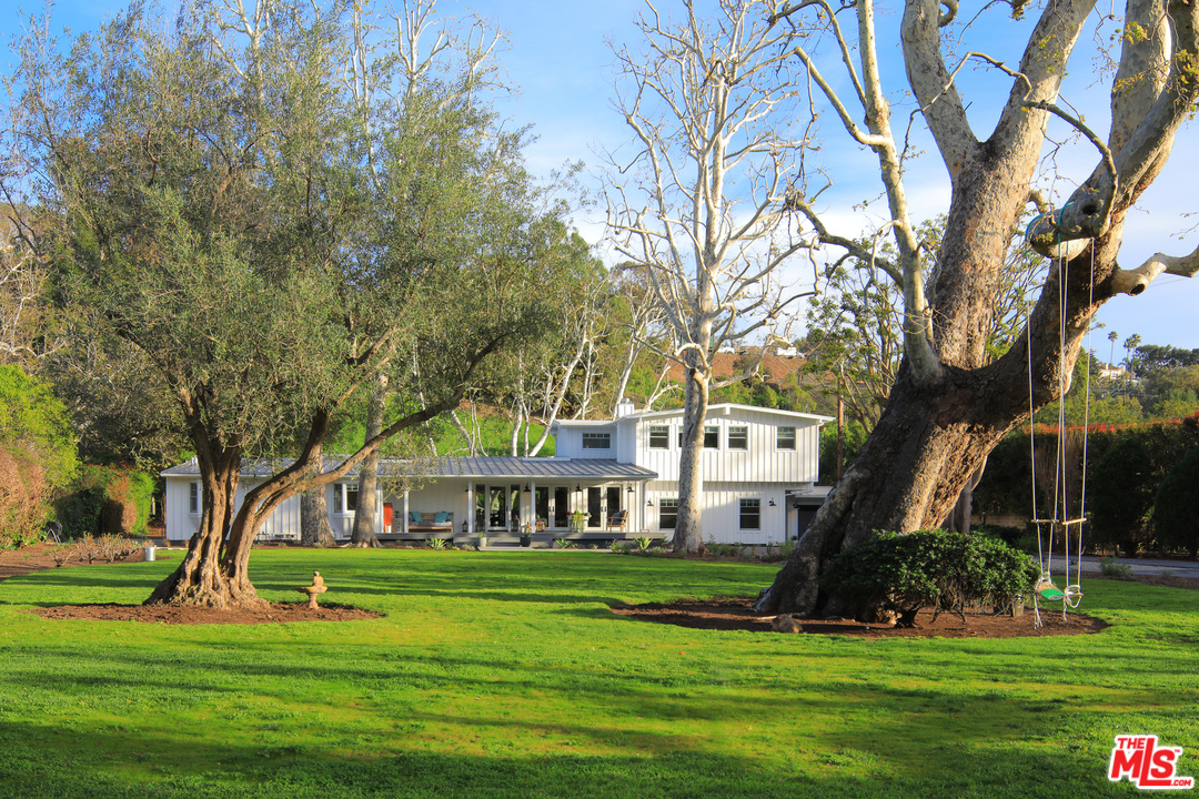 6152 Bonsall Drive Malibu, CA 90265 - Photo 3 of 26 a front view of a house with a yard