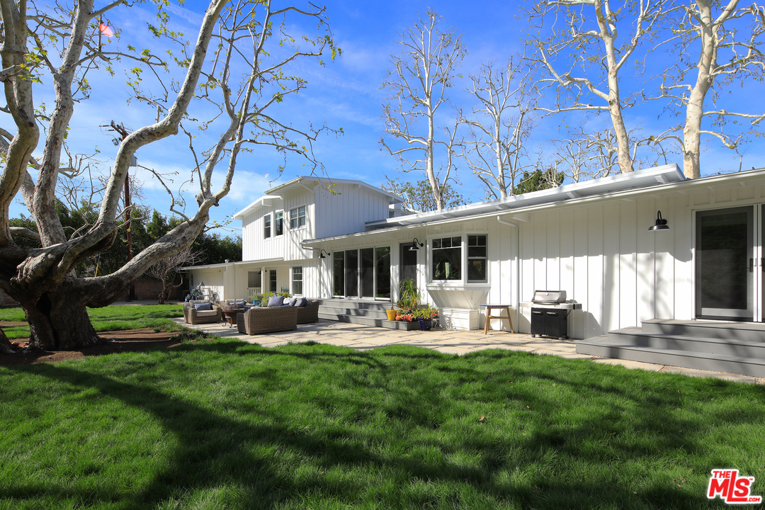 6152 Bonsall Drive Malibu, CA 90265 - Photo 24 of 26 a front view of a house with garden and sitting area