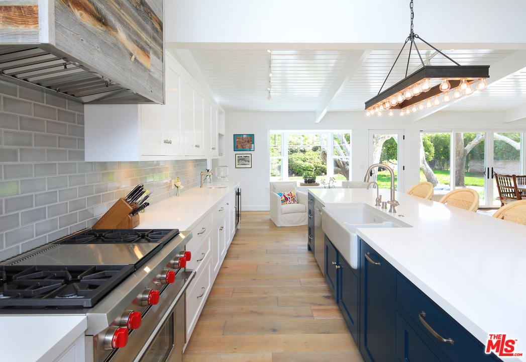 6152 Bonsall Drive Malibu, CA 90265 - Photo 7 of 26 a kitchen with stainless steel appliances a sink and stove