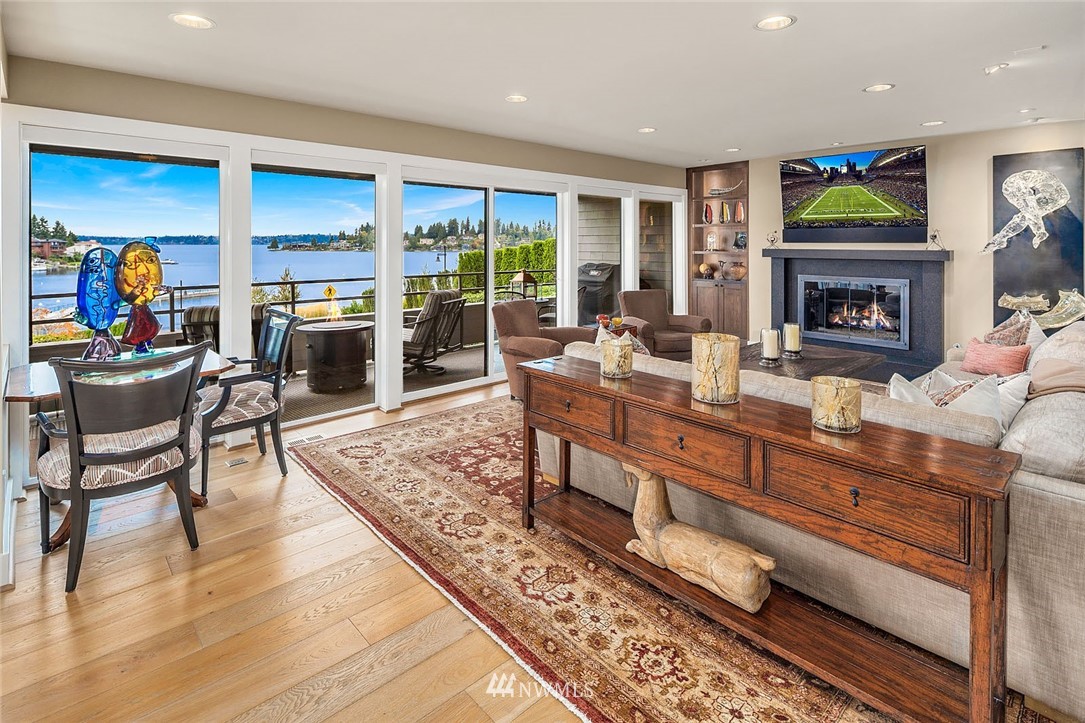 9901 Lake Washington Boulevard Northeast, Unit A1 Bellevue, WA 98004 - Photo 1 of 35 a living room with furniture fireplace and flat screen tv