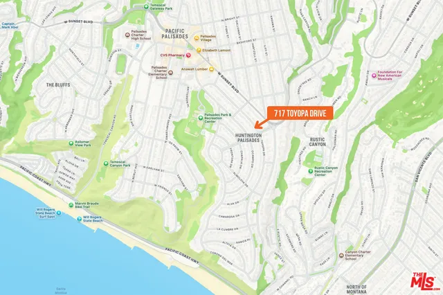 a blue sign that is on the side of a road