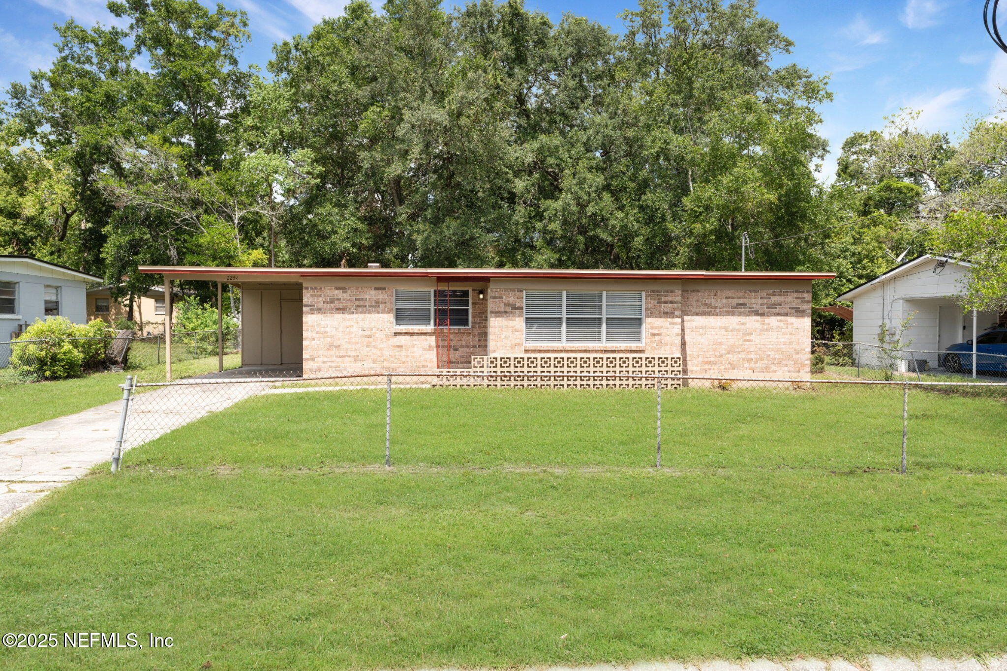 2254 Firestone Road Jacksonville, FL 32210 - Photo 1 of 20 a view of a house with backyard and porch
