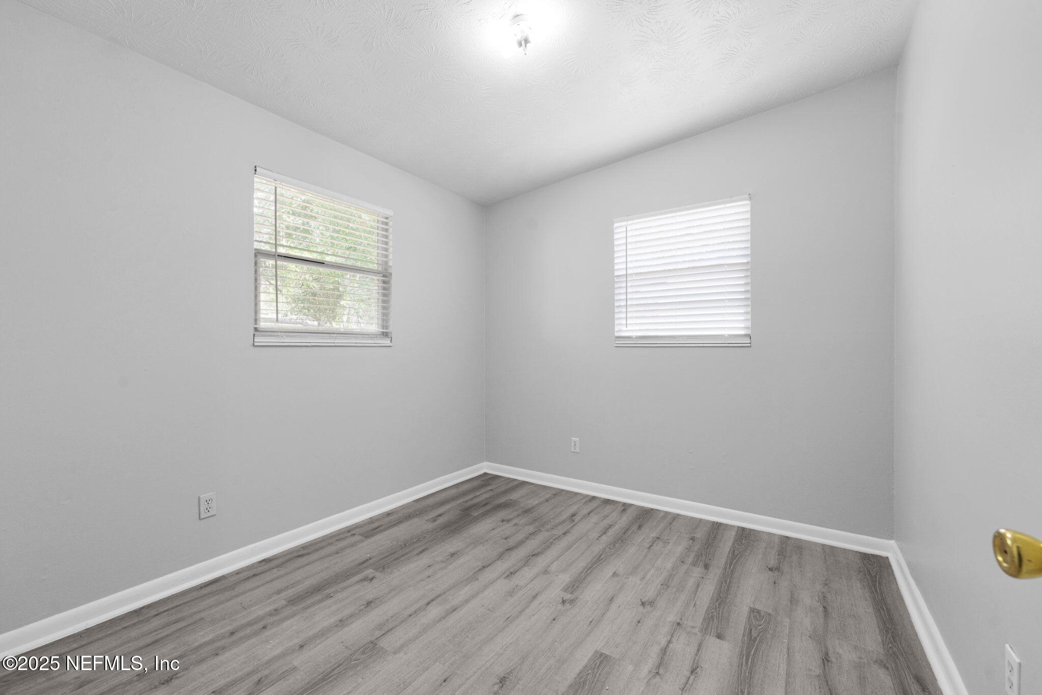 2254 Firestone Road Jacksonville, FL 32210 - Photo 12 of 20 an empty room with a window