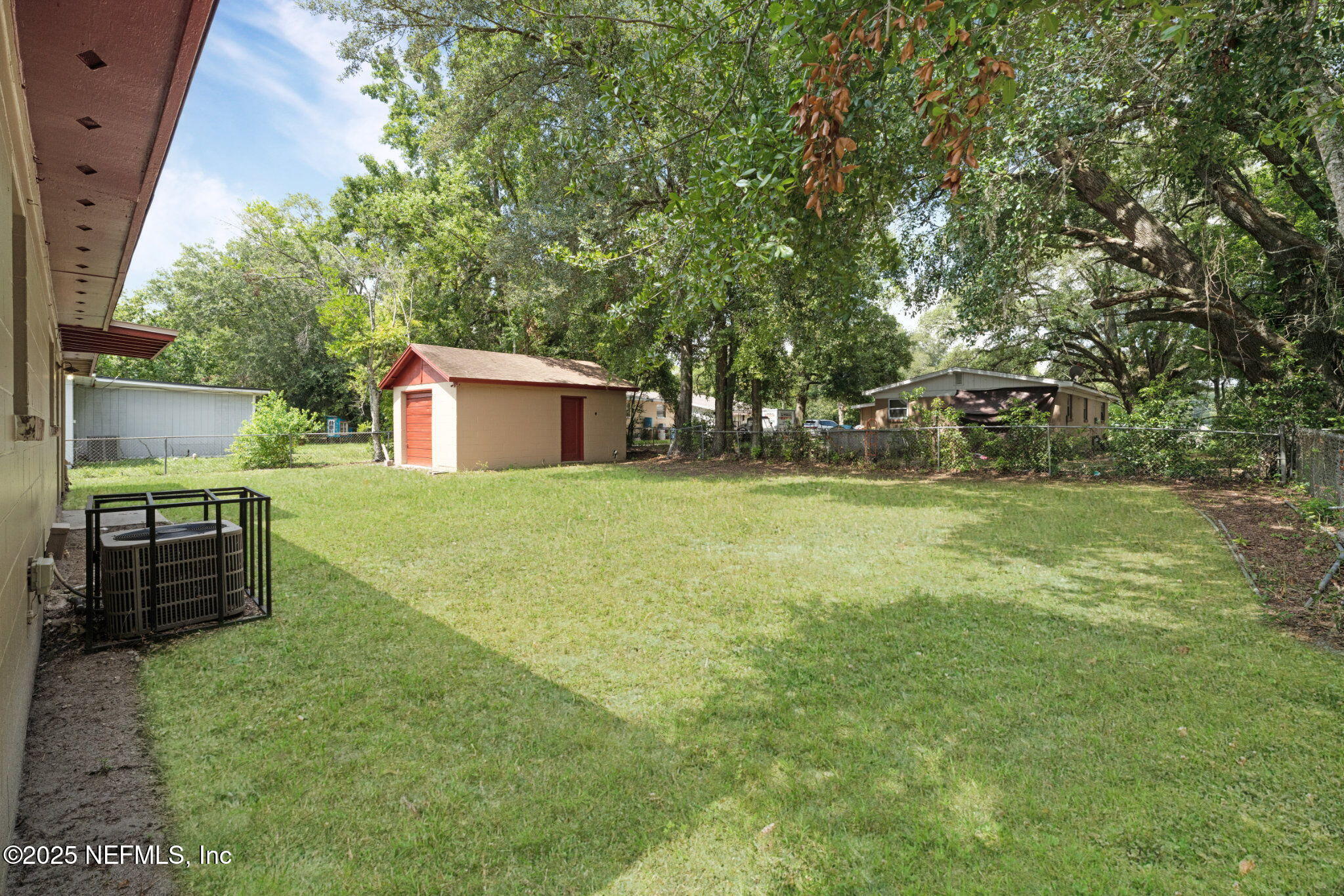 2254 Firestone Road Jacksonville, FL 32210 - Photo 19 of 20 a backyard of a house with barbeque oven
