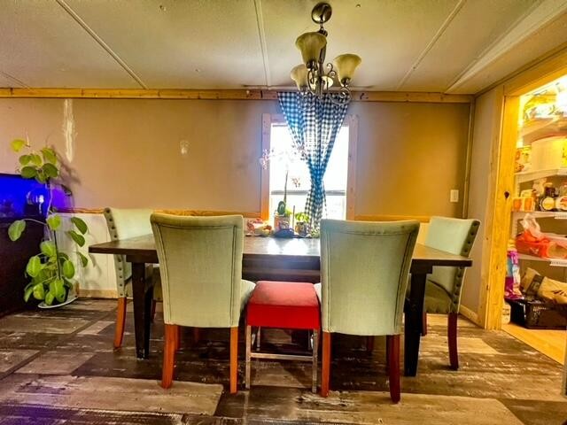 205 County Road 179 Decatur, TN 37322 - Photo 14 of 20 a view of a dining room with furniture and chandelier