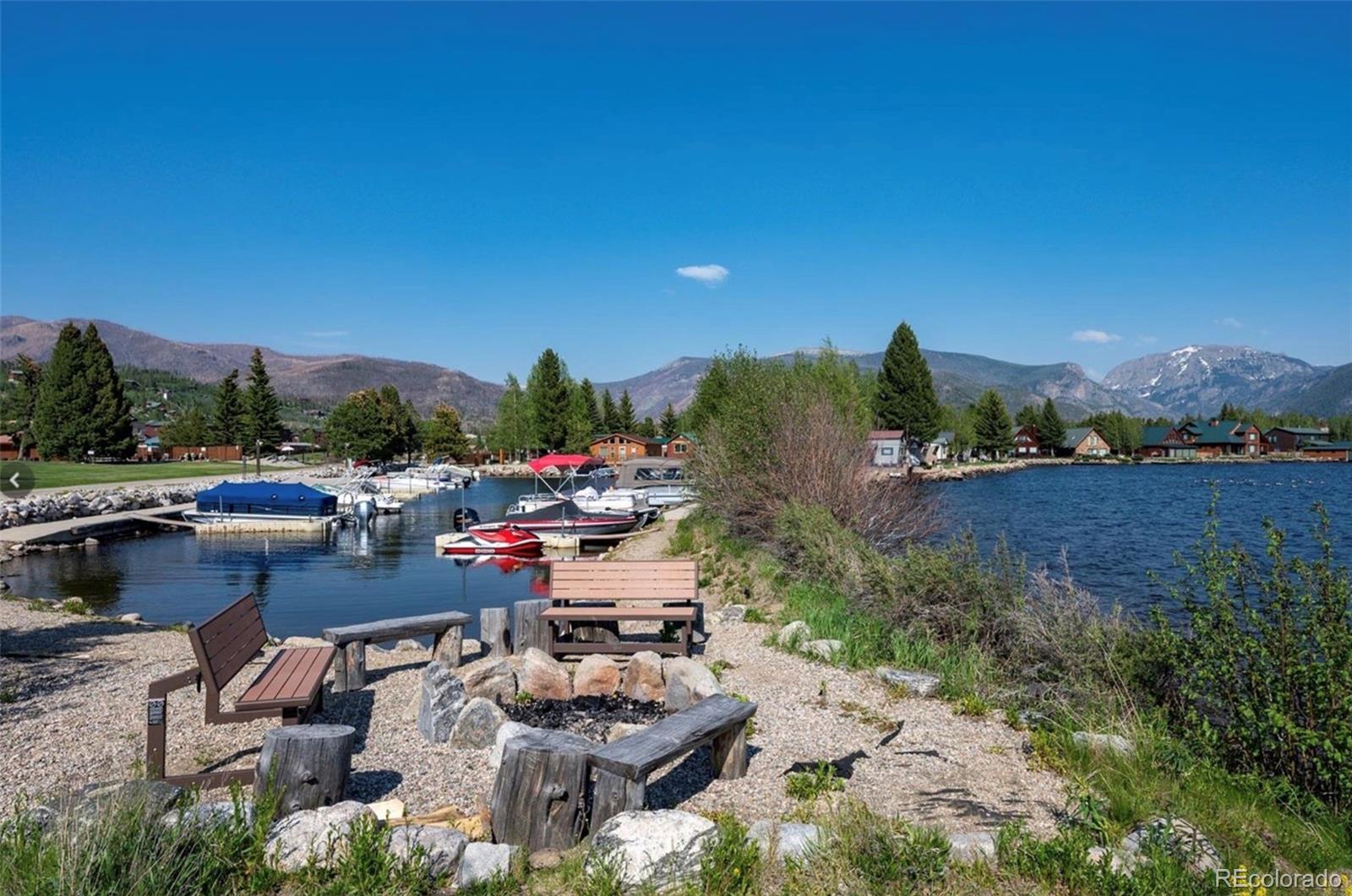 605 Lake Front Road, Unit 8 Grand Lake, CO 80447 - Photo 28 of 30 a view of a lake with couches and city view