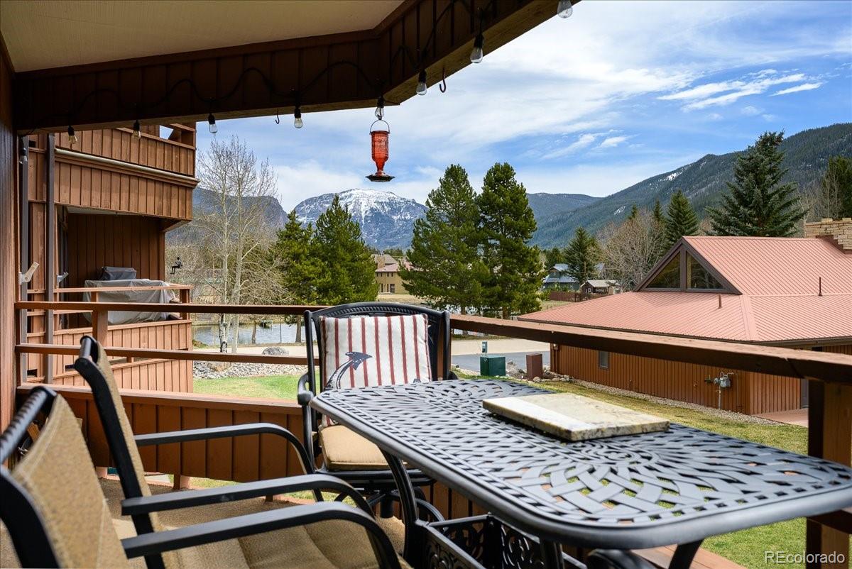605 Lake Front Road, Unit 8 Grand Lake, CO 80447 - Photo 5 of 30 a view of balcony with wooden floor and outdoor seating