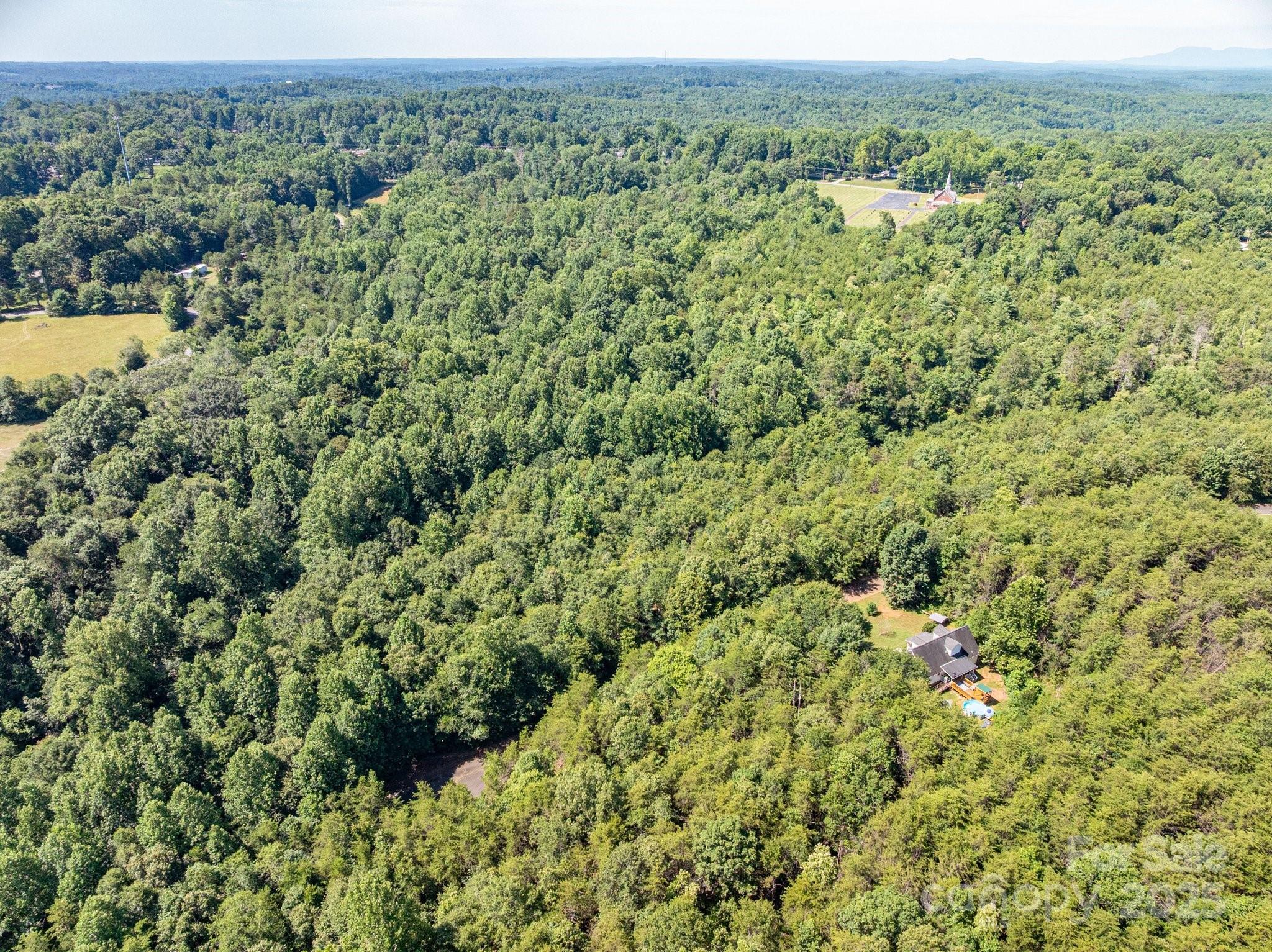 Lot # Meadow Crossing Drive Rutherfordton, NC 28139 - Photo 5 of 13 a view of a green field with lots of bushes