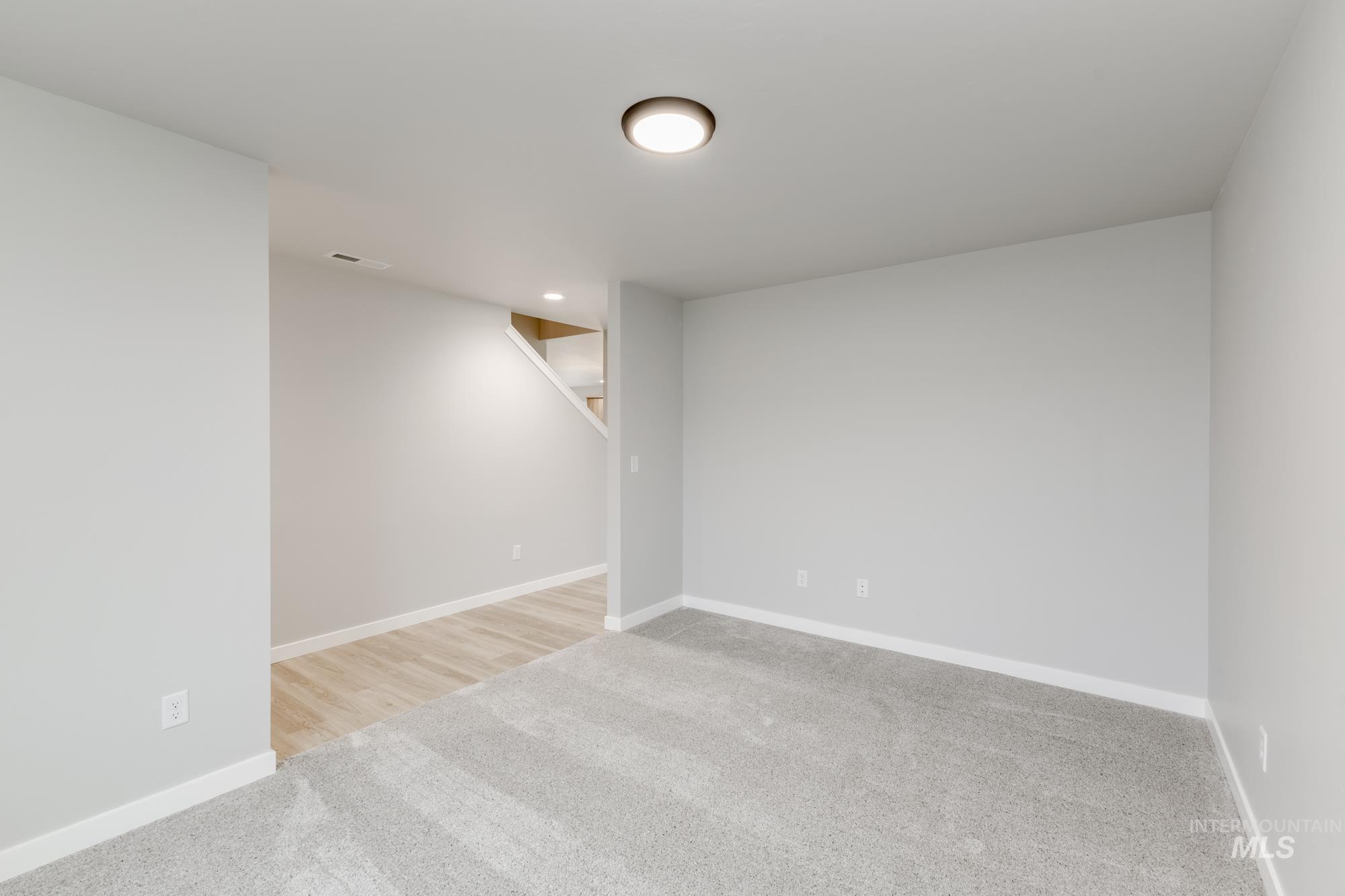 13743 Judson Street Caldwell, ID 83607 - Photo 10 of 23 Finished below grade area with light carpet and baseboards