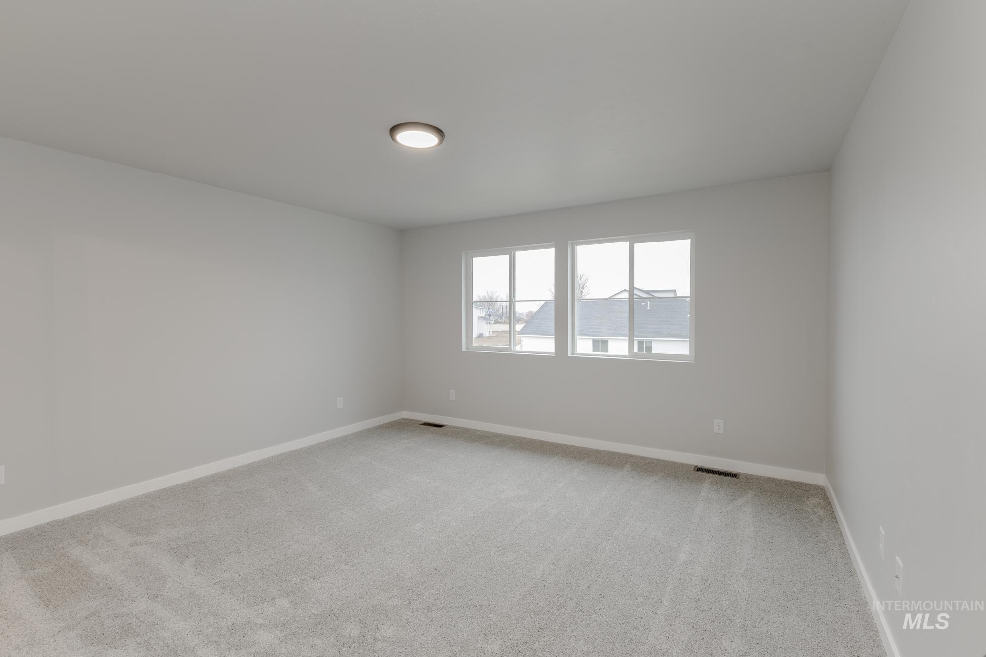13743 Judson Street Caldwell, ID 83607 - Photo 19 of 23 Spare room with light carpet and baseboards