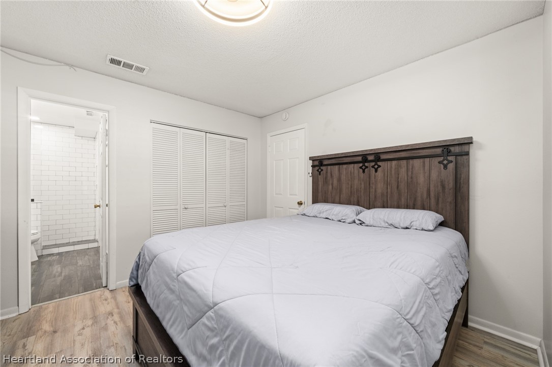 3103 Duffer Road Sebring, FL 33872 - Photo 17 of 29 a bedroom with a bed and a closet