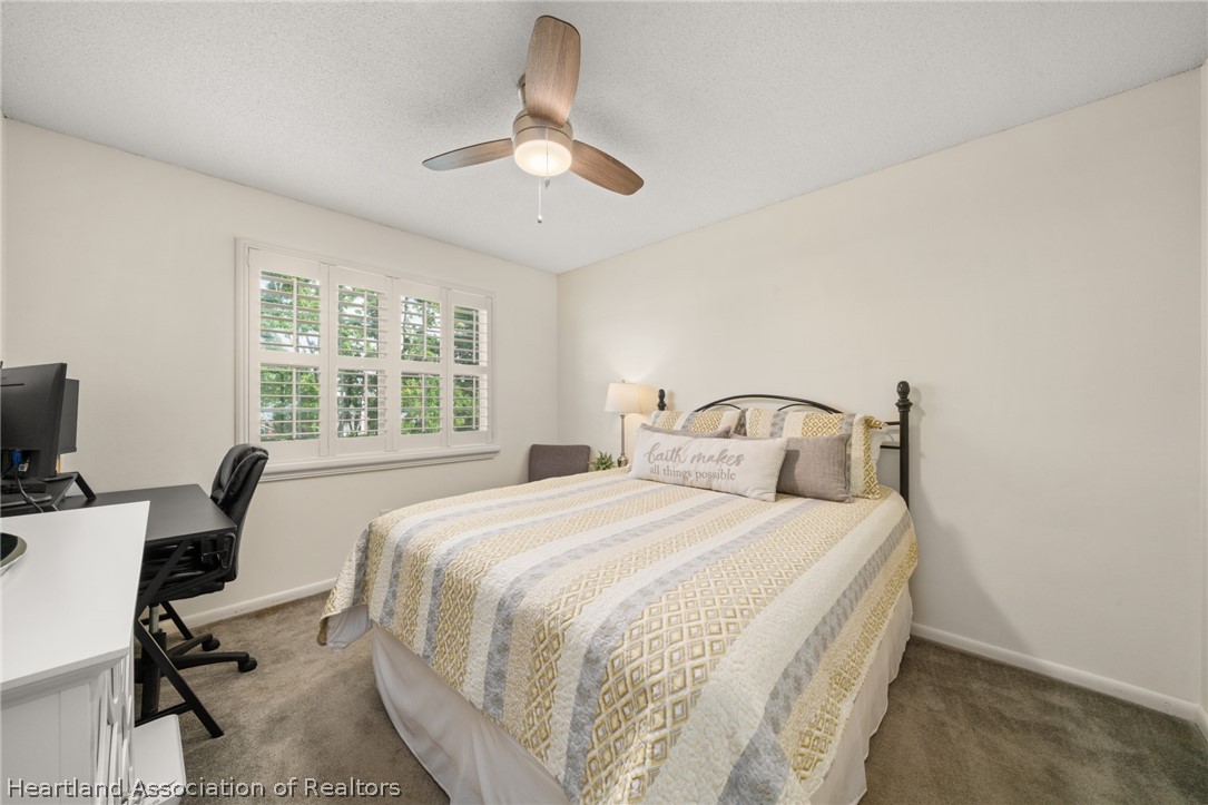 3103 Duffer Road Sebring, FL 33872 - Photo 18 of 29 a bedroom with a bed and a desk