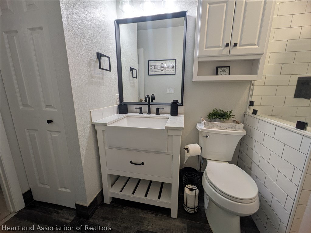 3103 Duffer Road Sebring, FL 33872 - Photo 20 of 29 a white toilet sitting next to a bathroom sink