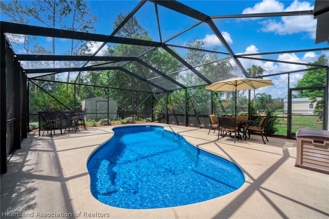 3103 Duffer Road Sebring, FL 33872 - Photo 2 of 29 a view of a swimming pool with a patio