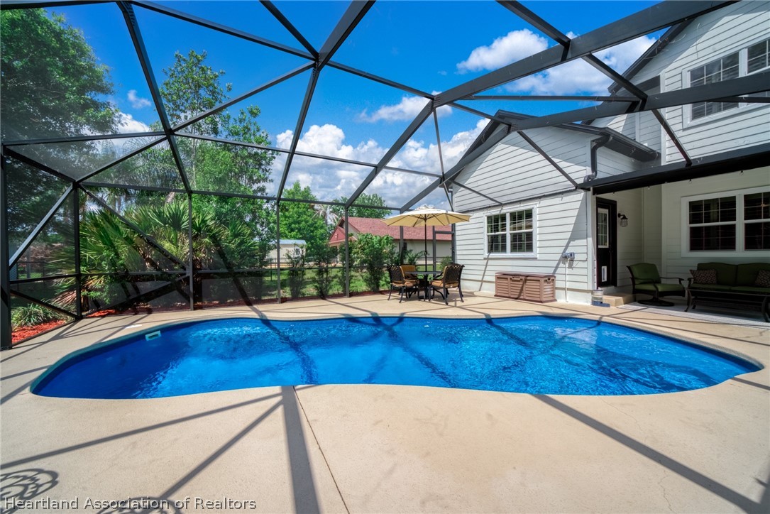 3103 Duffer Road Sebring, FL 33872 - Photo 23 of 29 a view of a swimming pool with a patio