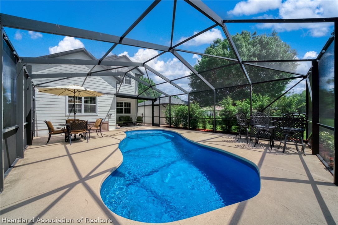 3103 Duffer Road Sebring, FL 33872 - Photo 24 of 29 a view of a swimming pool with a patio