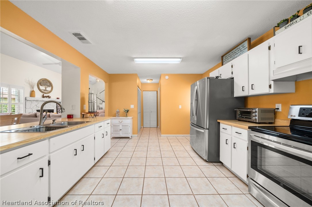3103 Duffer Road Sebring, FL 33872 - Photo 5 of 29 a kitchen with stainless steel appliances a sink cabinets and a window