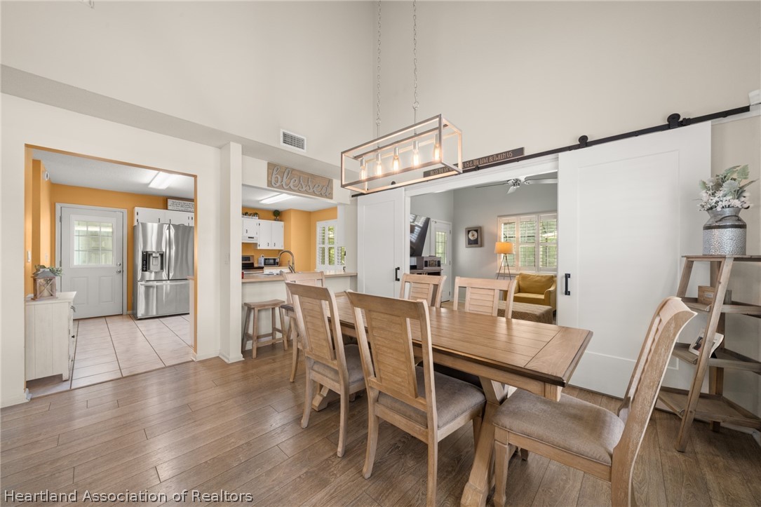 3103 Duffer Road Sebring, FL 33872 - Photo 7 of 29 a view of a dining room with furniture and wooden floor