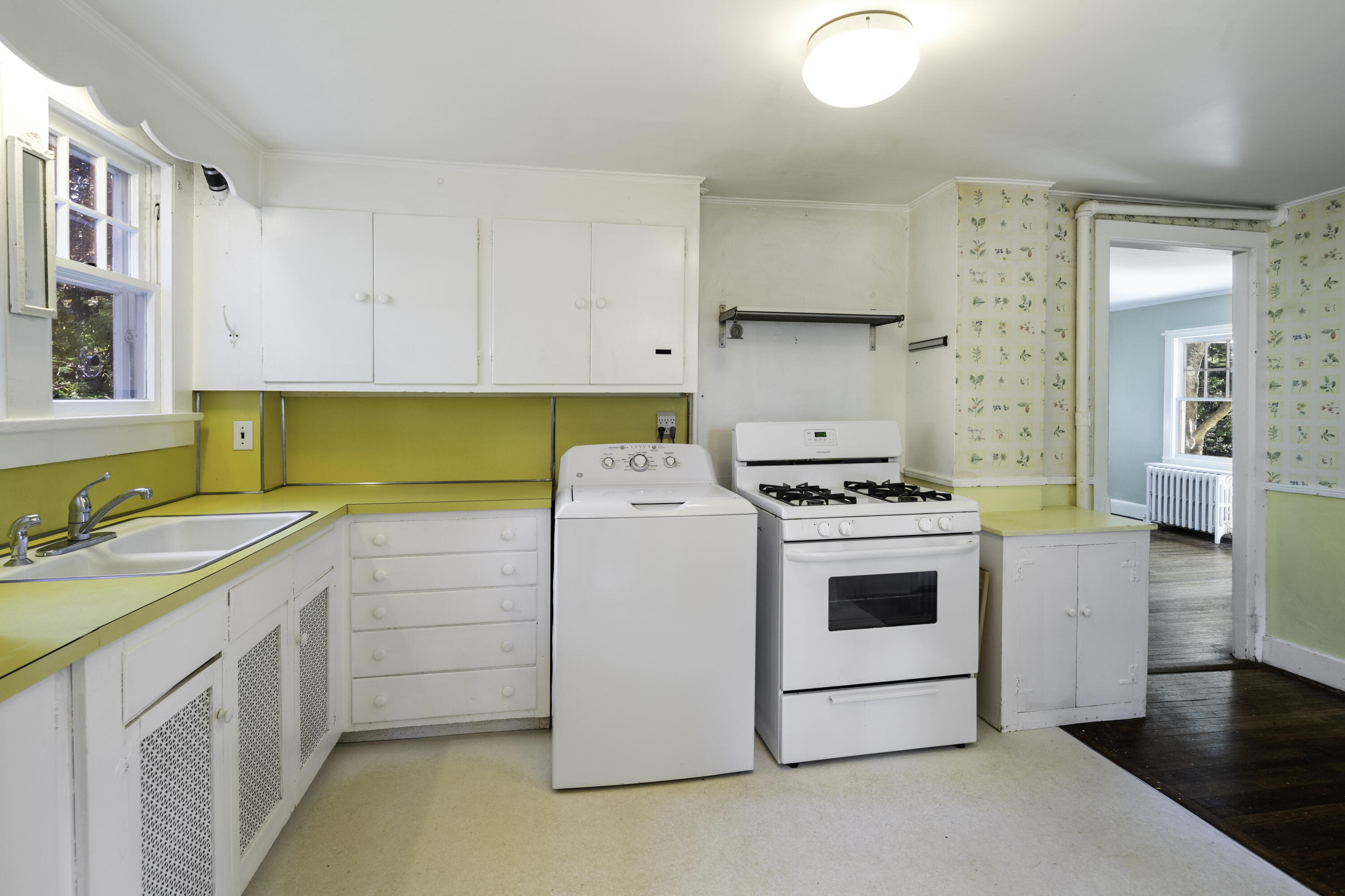 40 Ogden Road New Canaan, CT 06840 - Photo 13 of 35 a kitchen with a stove sink and cabinets