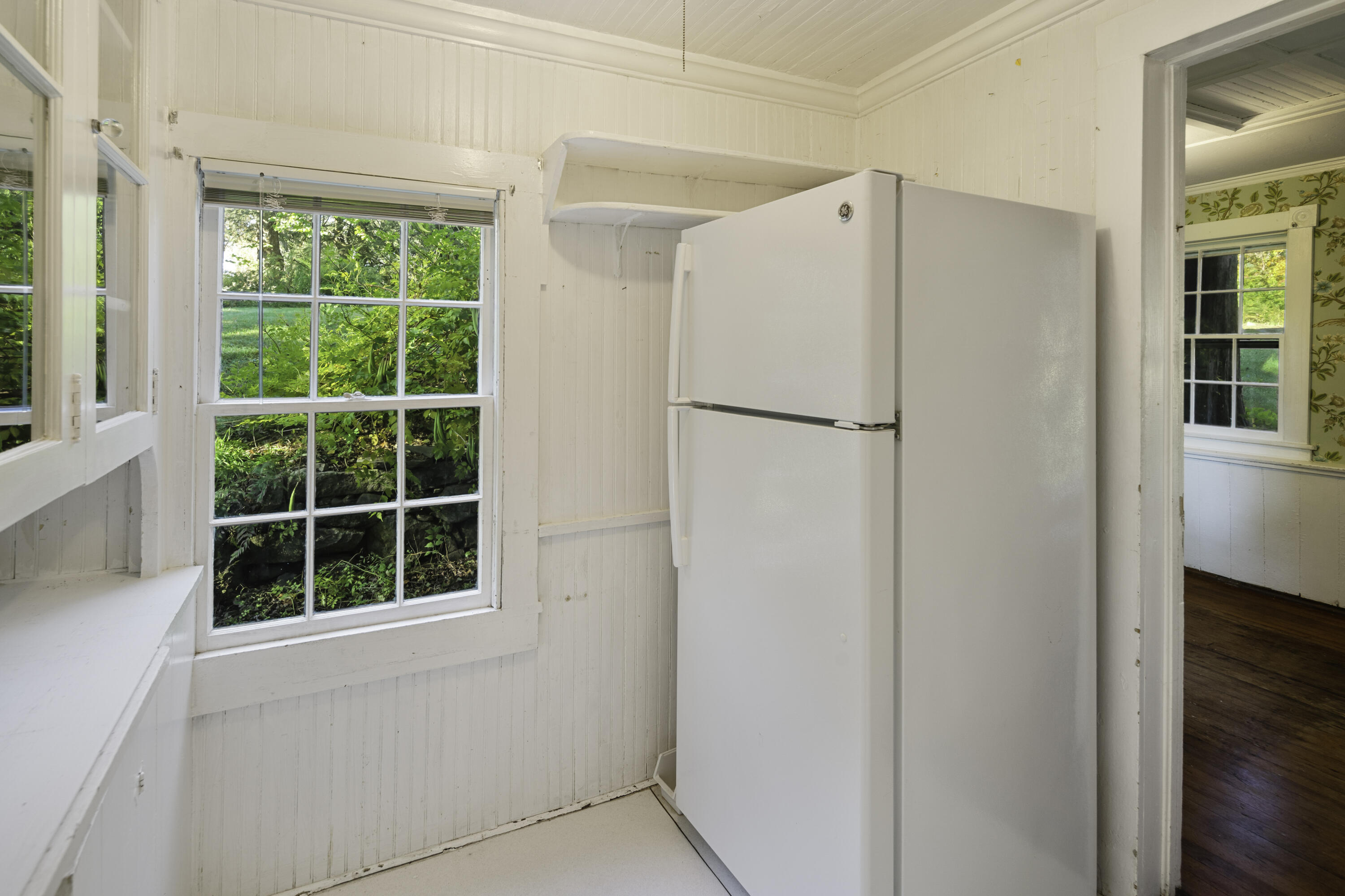 40 Ogden Road New Canaan, CT 06840 - Photo 14 of 35 a white refrigerator freezer sitting in a kitchen