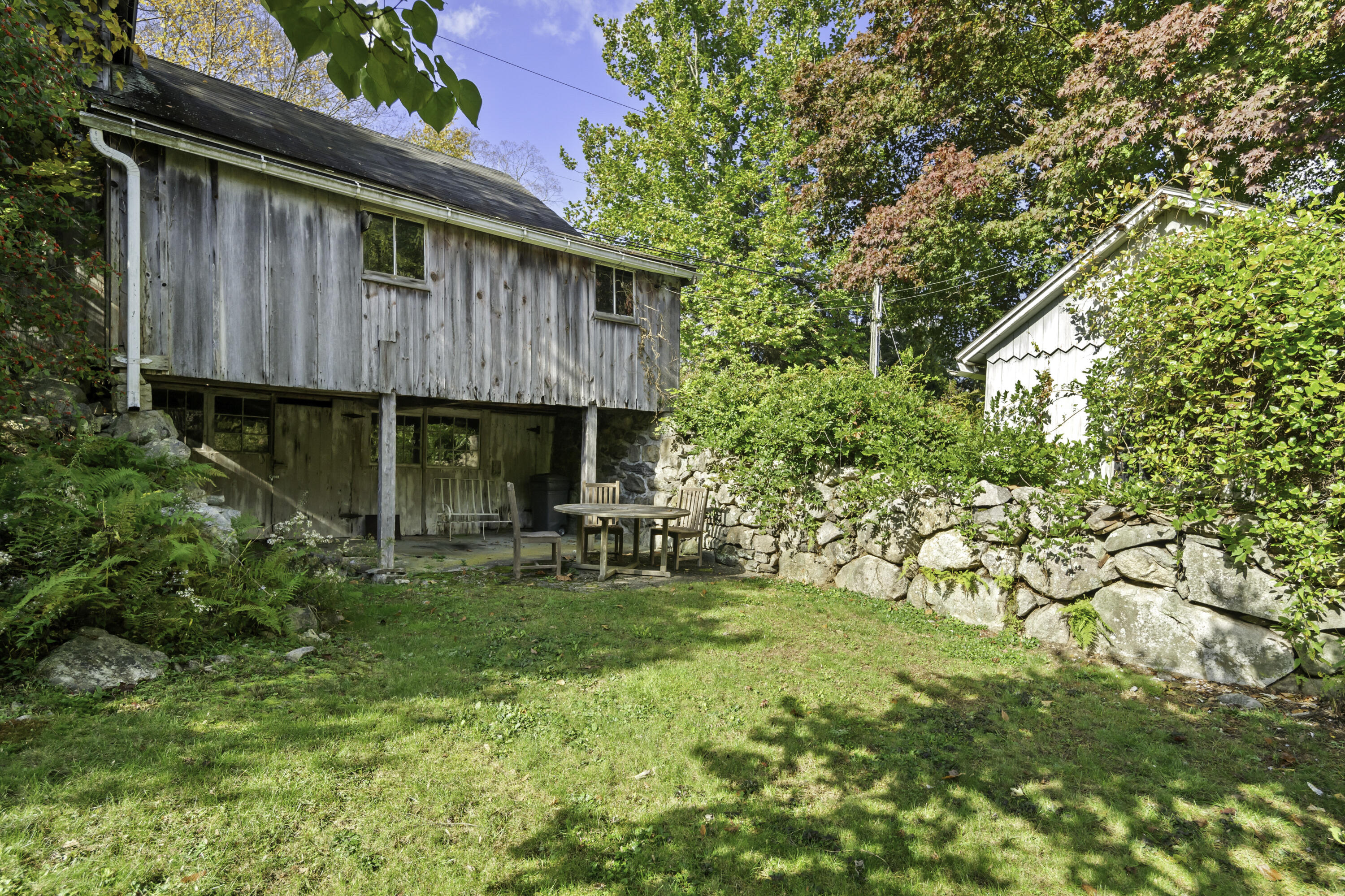 40 Ogden Road New Canaan, CT 06840 - Photo 21 of 35 a view of a house with a yard and sitting area