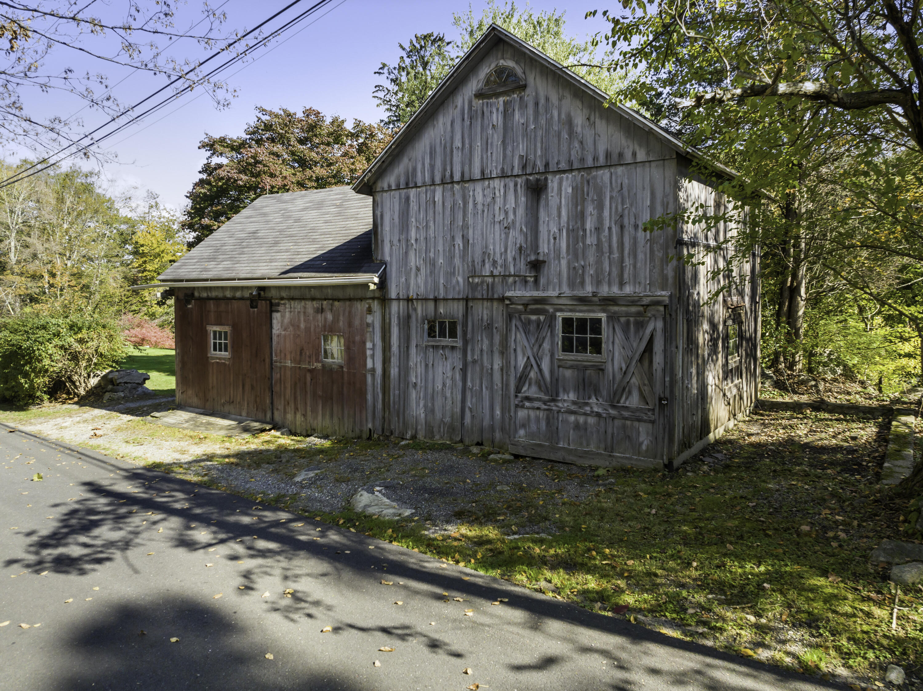 40 Ogden Road New Canaan, CT 06840 - Photo 28 of 35 a view of a house with a small yard