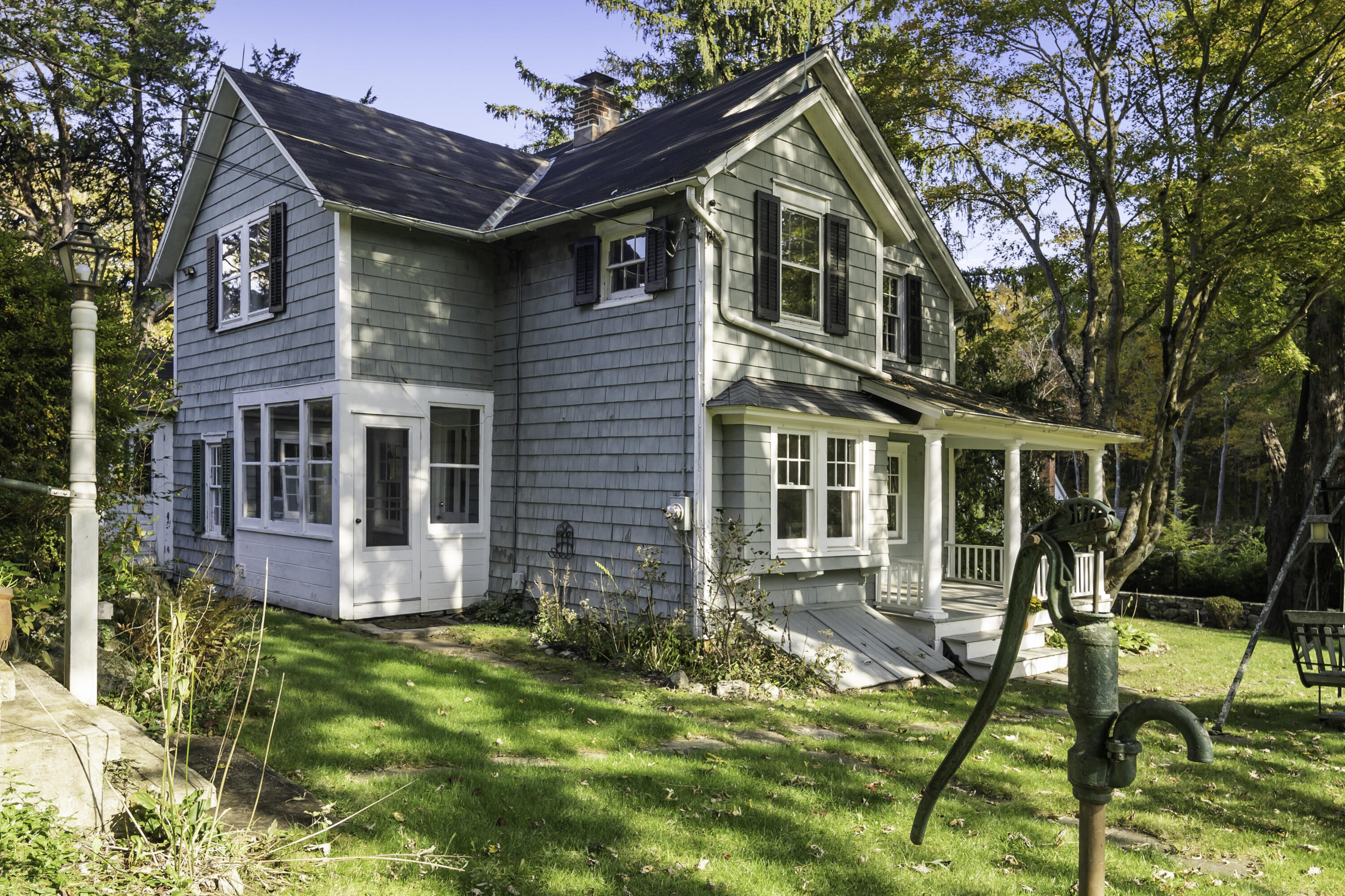40 Ogden Road New Canaan, CT 06840 - Photo 3 of 35 a front view of a house with a yard
