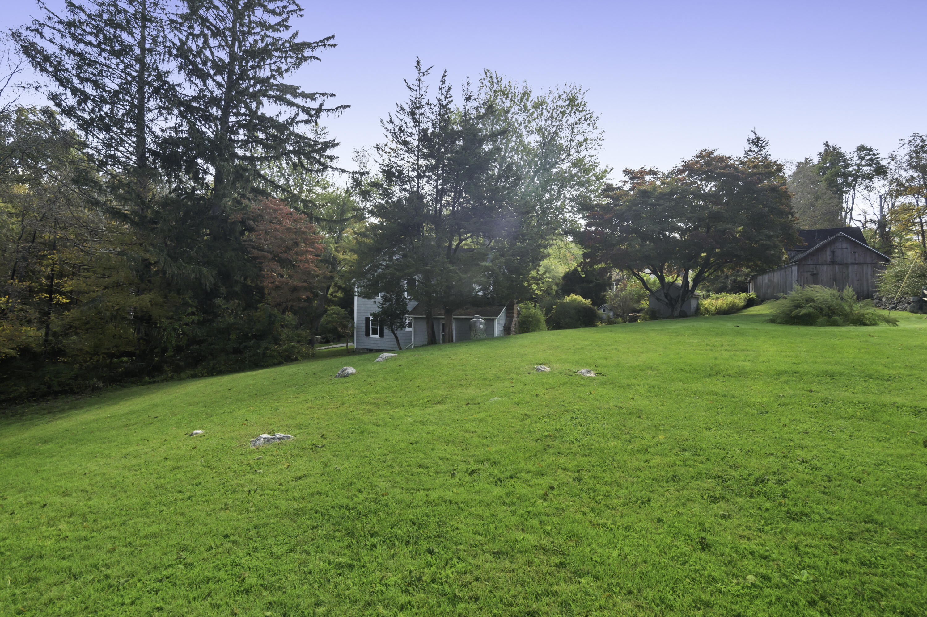 40 Ogden Road New Canaan, CT 06840 - Photo 33 of 35 a view of a field of grass and trees