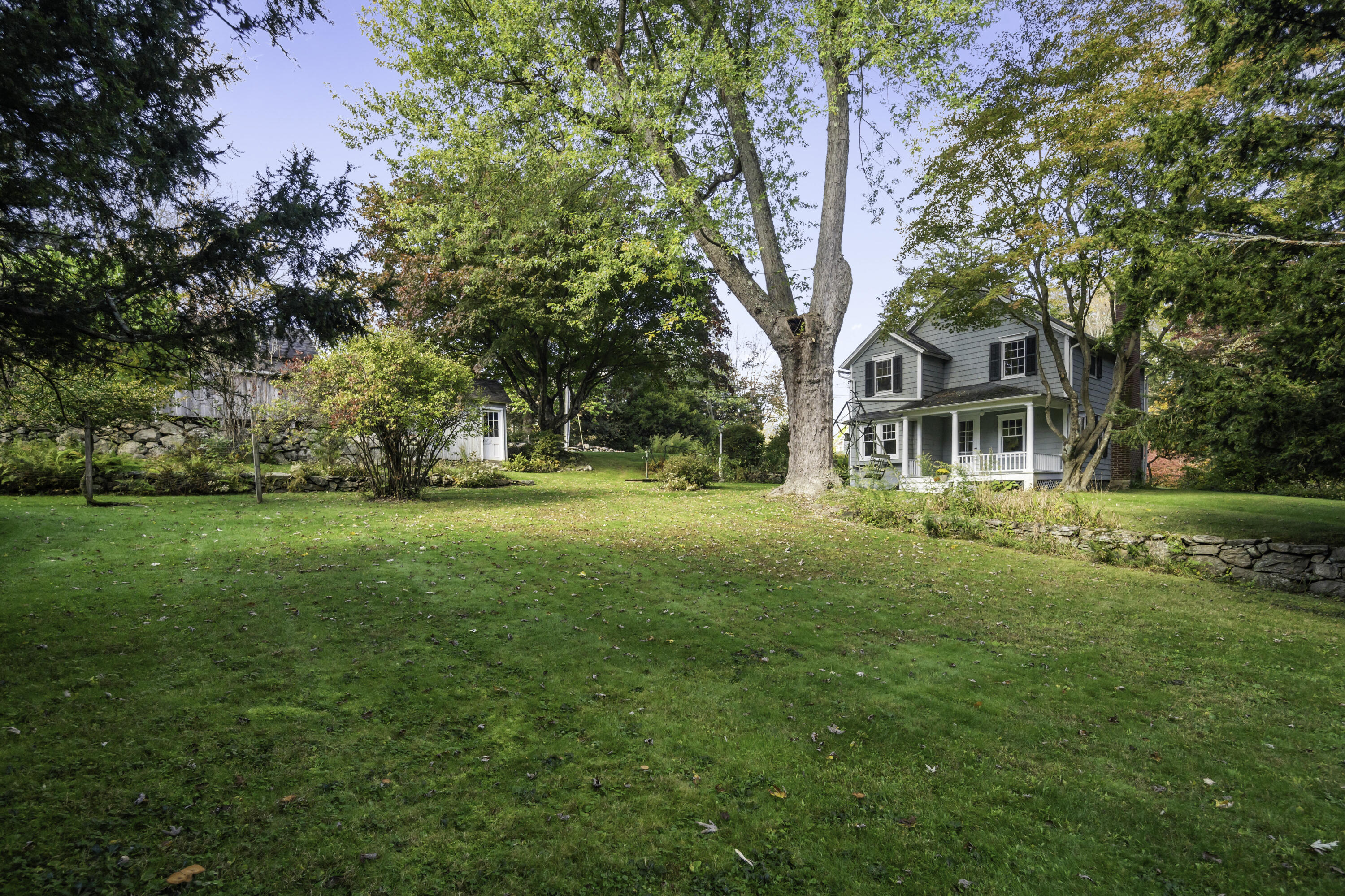 40 Ogden Road New Canaan, CT 06840 - Photo 4 of 35 a front view of a house with a yard