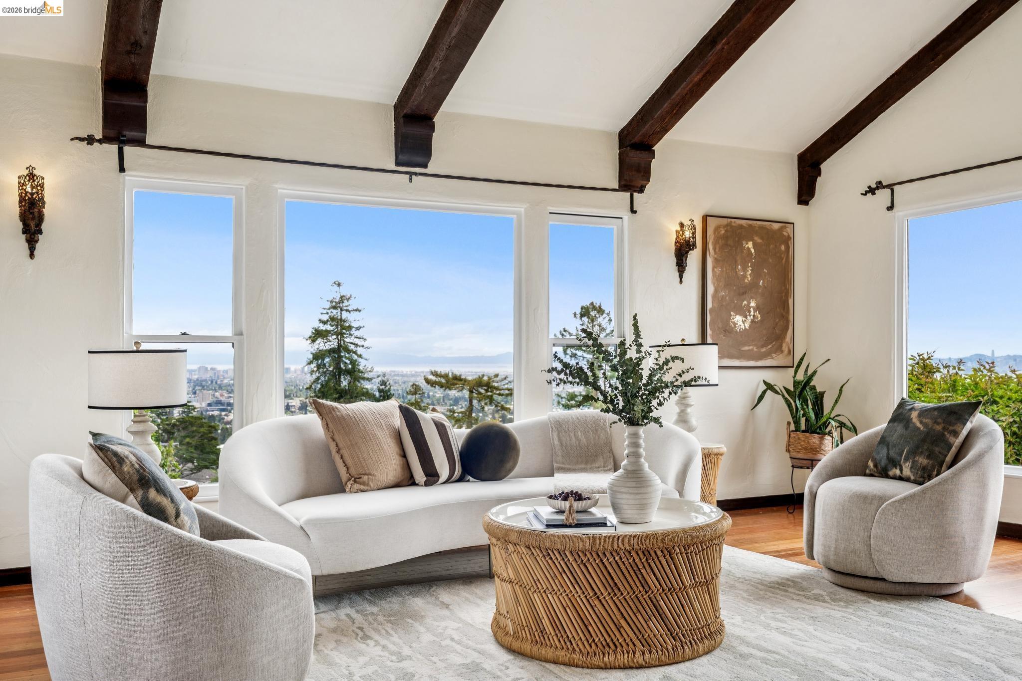 784 Cragmont Avenue Berkeley, CA 94708 - Photo 18 of 64 Living area with exposed beam vaulted ceiling, large picture windows, wood-finish flooring, and decorative sconce lighting